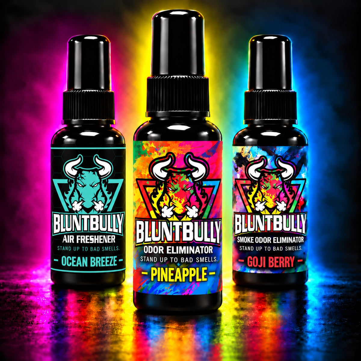 Blunt Bully Ocean Breeze Air Freshener, Pineapple Odor Eliminator and Goji Berry Smoke Odor Eliminator bottles against a colorful pink, yellow and blue smoke background